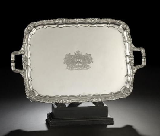 The arms of a Baronet Russell are engraved on this George IV Paul Storr sterling silver tray, hallmarked London, 1820-1821. The 22-inch long tray weighing 118.64 troy ounces is estimated at $14,000-$18,000. Image courtesy New Orleans Auction Galleries Inc.