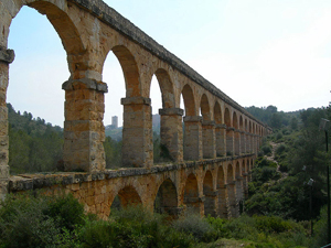 Catalonia's countryside is dotted with ancient houses and other structures, such as this Roman-built aqueduct near Tarragona. 2006 photo by Pamela McCreight. Courtesy Wikipedia.
