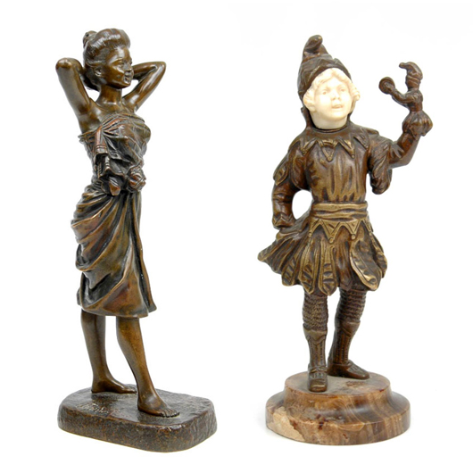 French bronzes in Stephenson’s auction include a figure of a woman, sculpted by Emile Pinedo; and a bronze and ivory figure of a child puppeteer by Omerth.