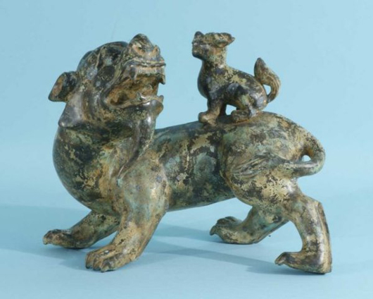 This bronze foo dog with pup, 12 1/2 inches high by 15 inches wide by 8 inches deep, has  a $350-$450 estimate. Images courtesy Lewis & Maese Auction Co.