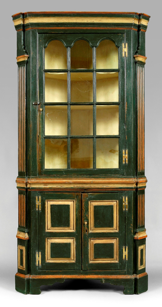 Roddy Moore of Ferrum, Va., purchased this 81¾ inch by 41 inch by 21 inch Eastern Shore, Virginia, corner cupboard for $64,900 (est. $12,000-$18,000). The arched glazed upper door with some of its early glass opens to deeply scalloped fixed shelves. The corner cupboard was featured in a 1978 exhibition, Furniture of Eastern Virginia. 