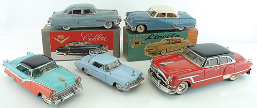 A group of 1950s Japanese tinplate cars, including a scarce Alps rendition of a 1953 Packard (lower right) with “Packard”-marked hubcaps, nickel and lithographed grille, “Packard” marked hub caps and driver figure in a sporty checked jacket. Estimate $4,000-$5,000. Noel Barrett Auctions image.