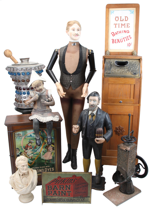 Examples from the Stark collection: wood cigar store figure, early wax-head mannequin, cast-iron ice shaver on marble base, Lincoln Tea promotional bust, 10-cent peepshow and more. Noel Barrett Auctions image.