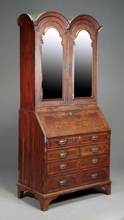 This George II walnut bureau bookcase, circa 1740, carries a $12,300-$18,400 estimate. It stands nearly 85 inches high by 38 1/2 inches wide. Image courtesy Dreweatts.
