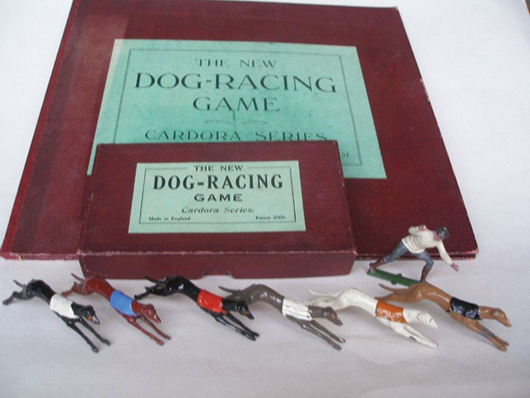 Johillco greyhound racing set with figures of six dogs and their handler. Old Toy Soldier Auctions image.