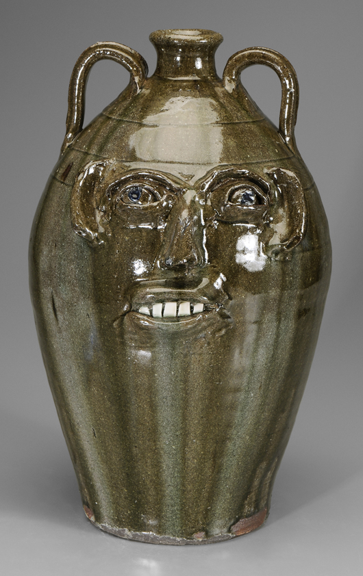 Monumental B.B. Craig (Lincoln County, N.C., 1914-2002) double-handle face jug. Estimate $1,000-$2,000. Brunk Auctions image.