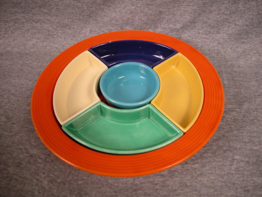 Fiesta relish tray, all six colors, red tray, turquoise center, cobalt, yellow, light green and turquoise sides, nick to tray, cobalt and yellow sides, estimate: $75-$125. Image courtesy Strawser Auctions.