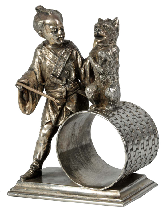 Large (4½ inch-tall) silver napkin ring depicting a samurai warrior instructing a dog. $4,000-$6,000. Dan Morphy Auctions image.
