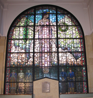 Designed by artist Grant Wood, the stained glass window is dedicated in memory of the men and women who gave their lives in defense of our country. Image courtesy of Glass Heritage, llc.