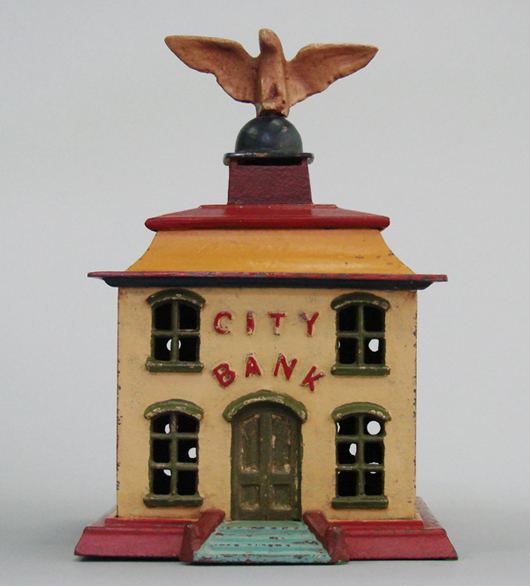 One of fewer than 10 known examples of the circa-1900 large version of the City Bank, painted cast iron, estimate $6,000-$8,000. RSL Auction Co. image.
