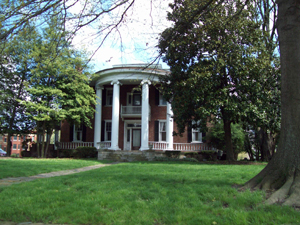 A former owner added Corinthian columns to the Holly Grove mansion in the early 1900s. Image courtesy of Wikimedia Commons.