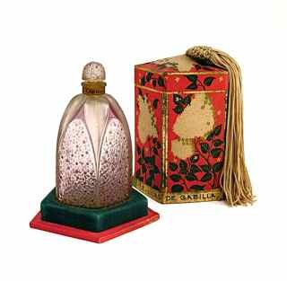 Rene Lalique provided the bottle for Gabilla’s fragrance Le Lilas in 1925. The frosted glass has a lavender patina, neck label and frozen stopper. The bottle has a molded ‘R. Lalique’ mark. In a rare tassel box, 3 3/4 inches tall, the package has a $5,000-$6,000 estimate. Image courtesy of Perfume Bottles Auction.