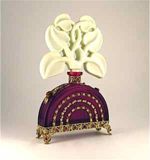 Bearing an ‘Ingrid’ mark, this 1920s Czechoslovakian perfume bottle is in ruby red crystal, with opaque ivory crystal openwork stopper, gilt metal filigree mount with jewels and Bakelite roses. It is 7 5/8 inches tall and has a $10,000-$12,000 estimate. Image courtesy of Perfume Bottles Auction.