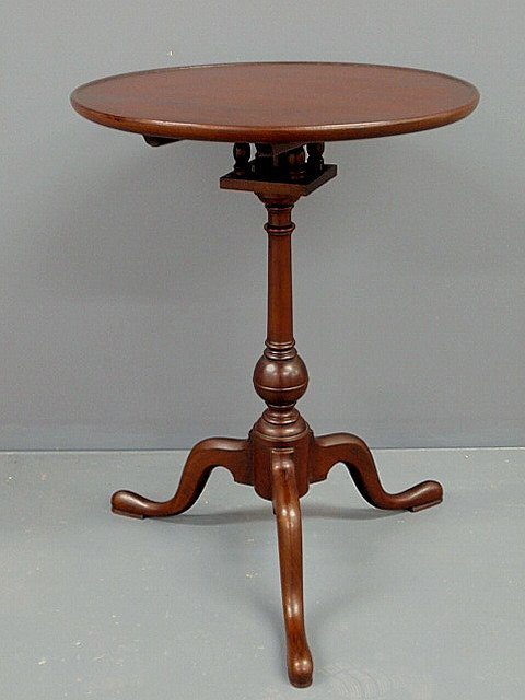 Bidding is expected to reach $4,500-$5,000 for this Pennsylvania Queen Anne mahogany dish-top candlestand, which features a birdcage support, ball turned shaft and snake feet. Image courtesy of Wiederseim Associates Inc.