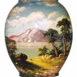 This red clay vase is marked ‘Matt Morgan Pottery’ and '1884.' The landscaped decoration on the 7-inch vase was hand-painted.