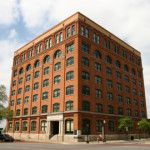 The Dallas County Administration Building, formerly the Texas School Book Depository, houses the Sixth Floor Museum. Photograph by Andrew J. Oldaker, courtesy of Wikimedia Commons.