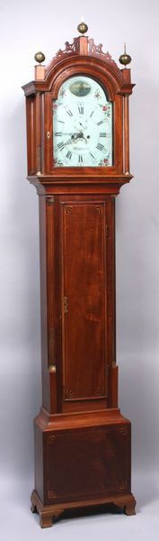 Important early 19th-century tall clock by William Cummins of Boston, case by Willard, mahogany inlaid with satin wood, ebony fan carving on door, painted and signed, 101 inches high by 19 1/2 inches wide by 9 1/2inches deep. Good condition. Est. $25,000-$35,000. Image courtesy of Kaminski Auctions.