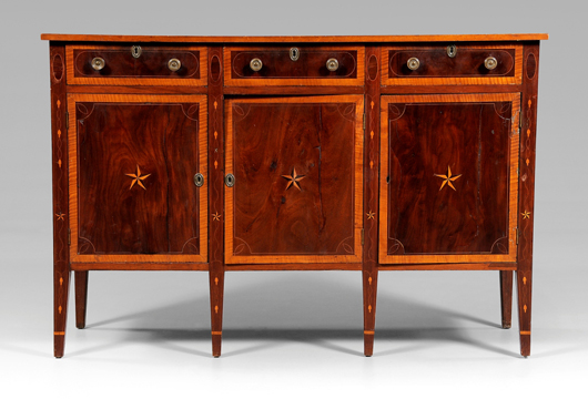 This Federal sideboard has three functional drawers over three doors that open to shelved interiors. Brasses are probably original. From Eastern Tennessee or Western North Carolina, it sold for $8,050. Image courtesy of Brunk Auctions.