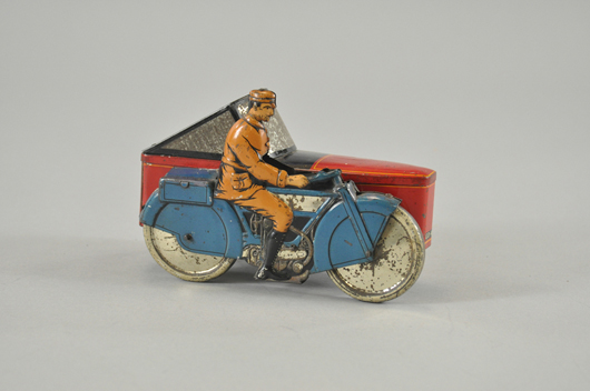 Gray Dunn (England) biscuit tin replicating a motorcycle with sidecar, 10 inches, $18,400. Bertoia Auctions image.