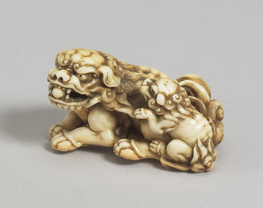 An 18th-century ivory netsuke of a shishi and cub, signed Tomotada, Kyoto, circa 1760-80, 2 inches long, will be on the stand of London dealer Sydney L. Moss at the Russian, Eastern & Oriental Fine Art Fair. Image courtesy Sydney L. Moss.