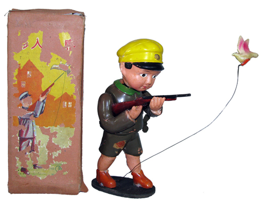 Prewar Japanese celluloid wind-up hunter toy. Mosby & Co. image.