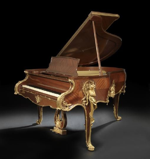 Grander than grand, this Steinway & Sons piano features a gilt-bronze-mounted parquetry art case in the manner of Francois Linke. In very good to excellent condition, the piano and bench have a $70,000-$100,000 estimate. Image courtesy of New Orleans Auction Galleries.