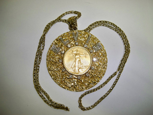 Elvis Presley gold medallion, estimate $1 million to $1.4 million. Image courtesy Fame Bureau.