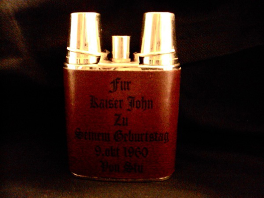 Hip flask personalized to John Lennon, estimate $2,800-$4,300. Image courtesy Fame Bureau.