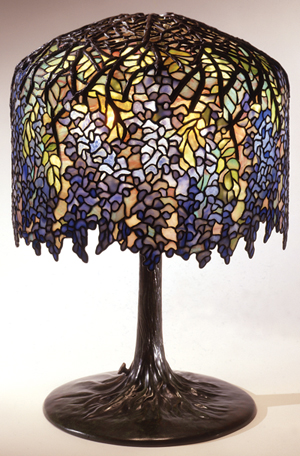 Louis Comfort Tiffany (American, 1848–1933) Wisteria Library Lamp leaded glass and bronze, 1900–1906 27 x 18 inches Organized by The Neustadt Collection of Tiffany Glass, New York, image courtesy Flint Institute of Arts.