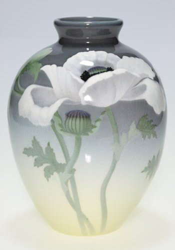 Rookwood’s Carl Schmidt decorated this 8 1/2-inch vase with large, flamboyant white poppies.  The Iris Glaze vase is dated 1904 and has a  $3,000-$4.000 estimate. Image courtesy of the Auctions at Rookwood.
