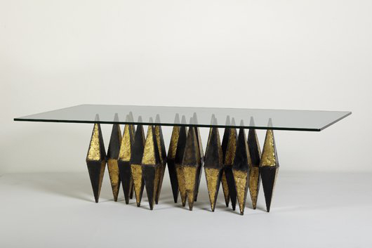 The winner of a dining table with beveled glass top and base with diamond-shape patinated and gilded steel base served up $71,050 at Phillips de Pury on April 28. Image courtesy of Phillips de Pury.