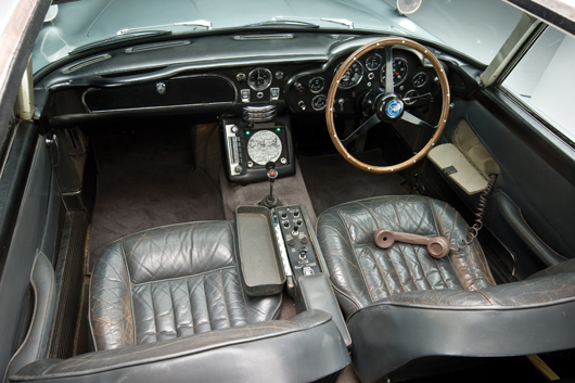 Overhead view of dashboard in James Bond's Aston Martin, image copyright Shooterz. Car to be auctioned Oct. 27 by RM Auctions.