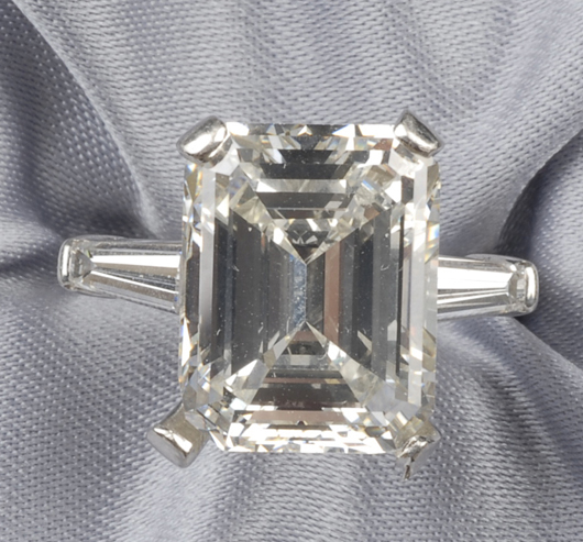 Platinum and diamond solitaire, prong-set with an emerald-cut diamond weighing 7.53 carats, flanked by tapered baguettes, size 6 3/4.  Estimate $40,000-$60,000. Image courtesy of Skinner Inc.