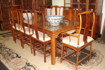 Ming Huang Huali (yellow flowering pearwood) dining table and eight chairs. Image courtesy of Finney’s Auction Service.