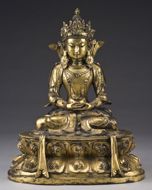Considered an important piece, this Chinese-Tibetan Qing gilt bronze Amitayus Buddha from the 17th or 18th century sold within estimate for $27,485. Image courtesy of Dallas Auction Gallery.
