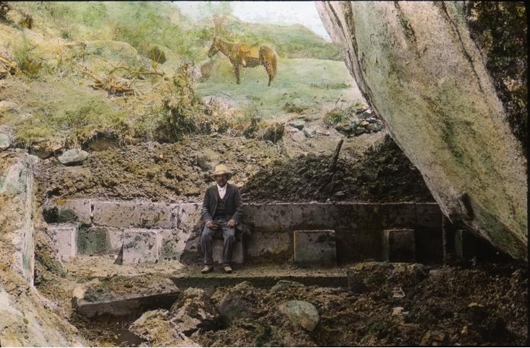 Hand-tinted glass slide of man sitting on Incan ruins in Peru. Photograph by Harry Ward Foote, who accompanied Hiram Bingham on his expedition to Machu Picchu in 1911. Harry Foote was a Yale Ph.B. (1895) and Ph.D. (1898), and a Yale College chemistry professor, who served as the expedition collector and naturalist on Bingham's expeditions to Peru. Image courtesy of the Yale Peruvian Expedition Papers, Yale University Manuscripts & Archives Digital Images Database, Yale University, New Haven, Connecticut.