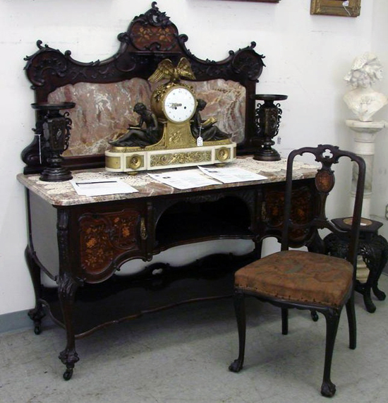 This marble-top mahogany washstand of an extravagant eight-piece 19th-century marquetry inlaid bedroom suite will be sold with a matching chair. Other pieces of the suite will be sold in succession. The washstand and chair are estimated at $1,000-$2,000. Image courtesy of Professional Appraisers and Liquidators LLC Antique Auctions.