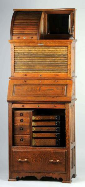 Circa-1880 oak dental roll-top/middle/bottom dental cabinet by Harvard, nine swivel drawers, 68 1/2 inches tall, collection of Dr. John Muhr. Estimate $3,000-$5,000. Dan Morphy Auctions image.