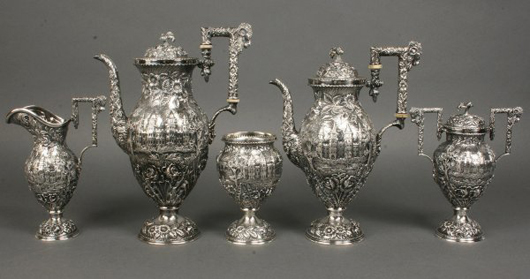 Late 19th or early 20th century Baltimore repoussé Castle Pattern tea service, five pieces, $7,945. Image courtesy of Case Antiques Inc.