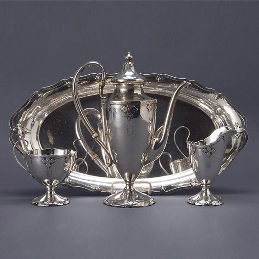 Shreve & Co. made this sterling silver four-piece tea service in the Fourteenth Century pattern. Bearing a "B" monogram, the set has a $2,000-$3,000 estimate. Image courtesy of Michaan’s Auctions.