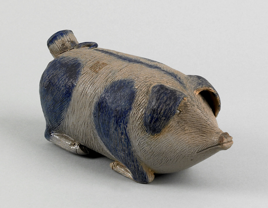 The appealing character of this cobalt-painted pig flask, attributed to an Illinois pottery, took the final price to $37,440 in 2007. Courtesy Pook & Pook.