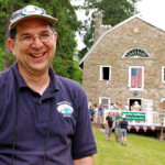 Larry Luxenberg, president of the Appalachian Trail Museum Society, greets visitors outside the 200-year-old gristmill that was renovated to house the museum. Image courtesy of the Appalachian Trail Museum Society.