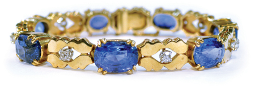 This diamond and blue sapphire bracelet is mounted in 14K yellow gold and set with seven oval cushion blue sapphires accented by seven old mine cut diamonds. Image courtesy of Clars Auction Gallery.