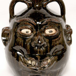 Double face jug by the late renowned folk artist Lanier Meaders. Image courtesy of Slotin Folk Art.