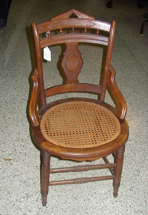 The material in the seat of this late 19th-century chair is cane, not cain, not wicker, not even wick.