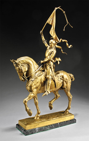 French gilt bronze statuette of ‘Jeanne d'Arc à Cheval,’ after Emmanuel Frémiet (French, 1824-1910), original maquette 1872-73, cast signature ‘E. Fremiet’ on top surface of self-base, height 29 inches, length 15 inches, width 7 1/2 in., on variegated marble base, estimate: $4,000-$8,000. Image courtesy of Neal Auction Co.