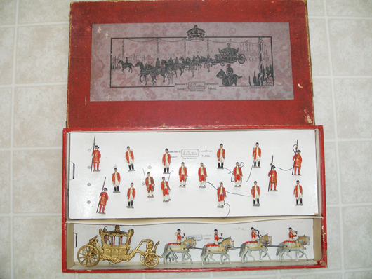Extremely rare version of Britains Set #1476, Coronation Coach with single figure of uncrowned King Edward VIII, made in 1937, $5,015. Old Toy Soldier Auctions image