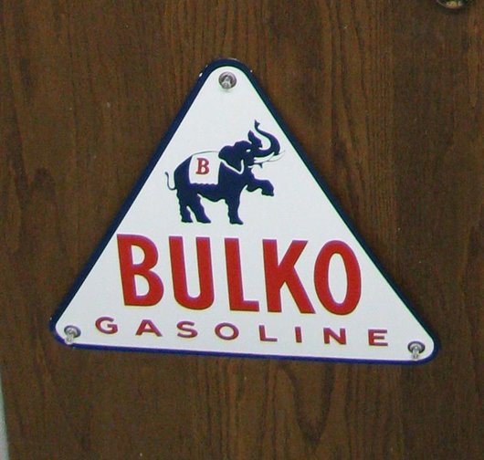 Rare Bulko Gasoline porcelain sign with elephant graphic and white background, rated 9+/10. Image courtesy Matthews Auctions.