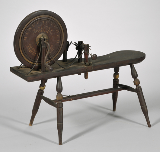 19th-century painted and stencil-labeled wooden spinning wheel, labeled "Manufactured by M. Bright, Circleville, Ohio, Patent Pending." Estimate $200-$250.