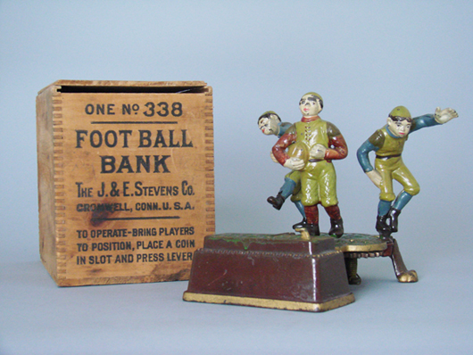 J. & E. Stevens Calamity cast-iron mechanical bank, circa 1905, depicts Yale and Harvard football players, $78,975. RSL Auction image.